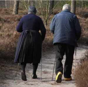 elderly-couple-hiking-poles